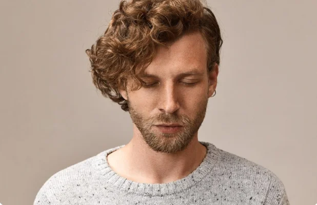 Embracing Natural Texture: A Trending Men's Hairstyle for 2025