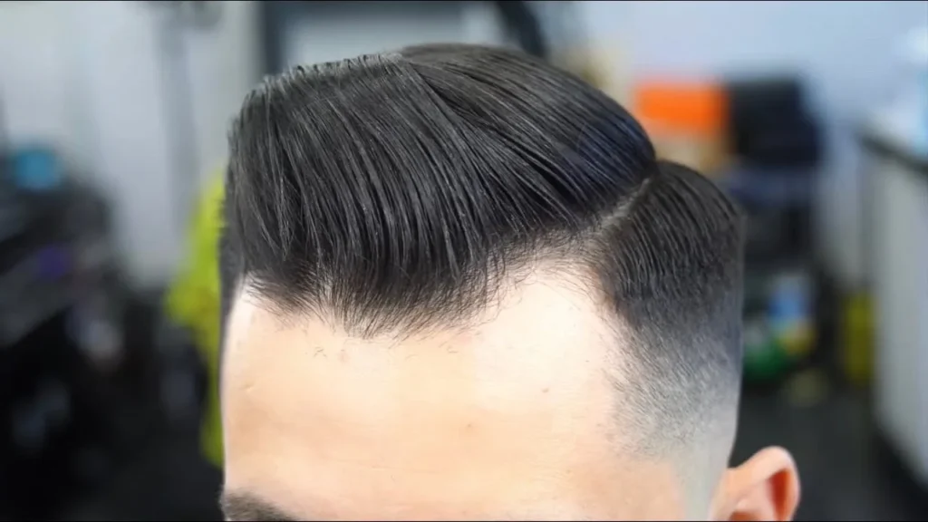 Modern comb over hairstyle for men with clean fade and natural volume – trendy 2025 look