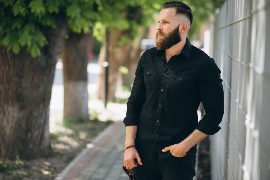 Men’s slicked-back undercut with sharp contrast between long top and short sides.