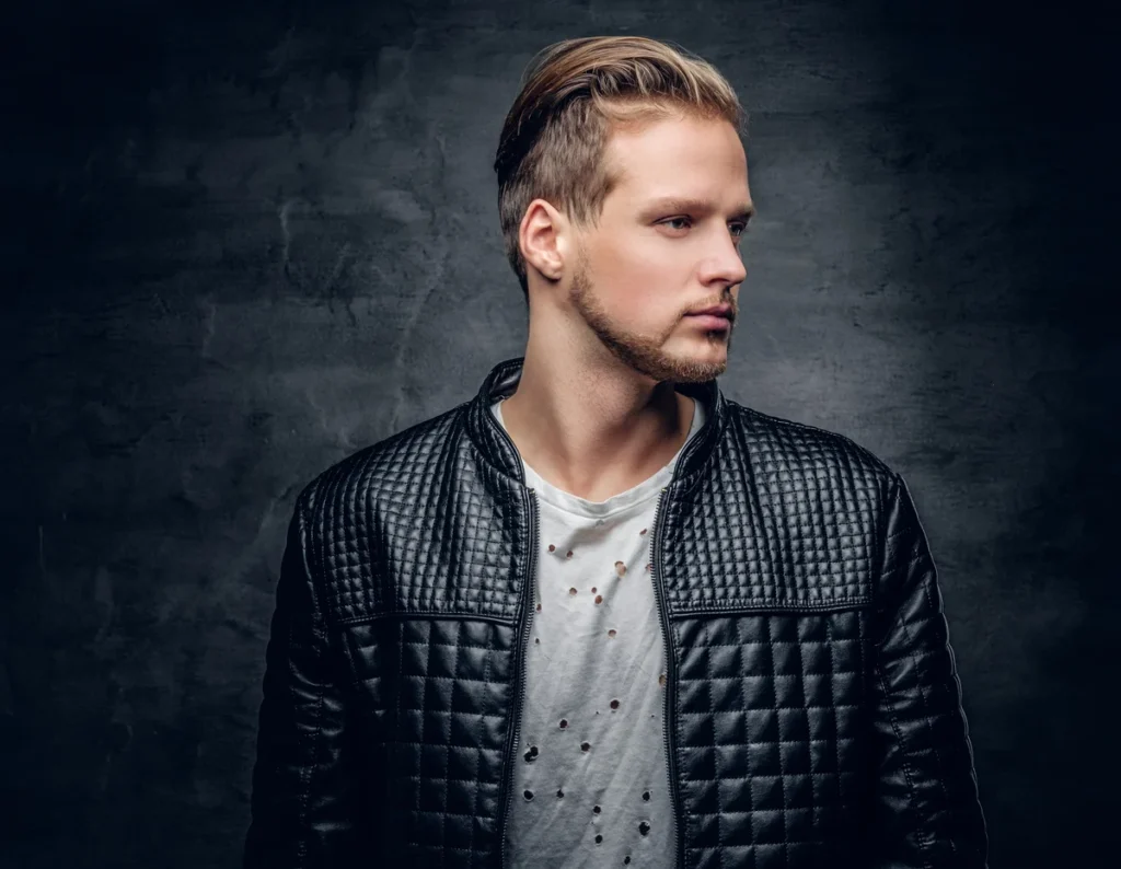 2025 men’s haircut featuring a crisp side part and clean taper on the sides.