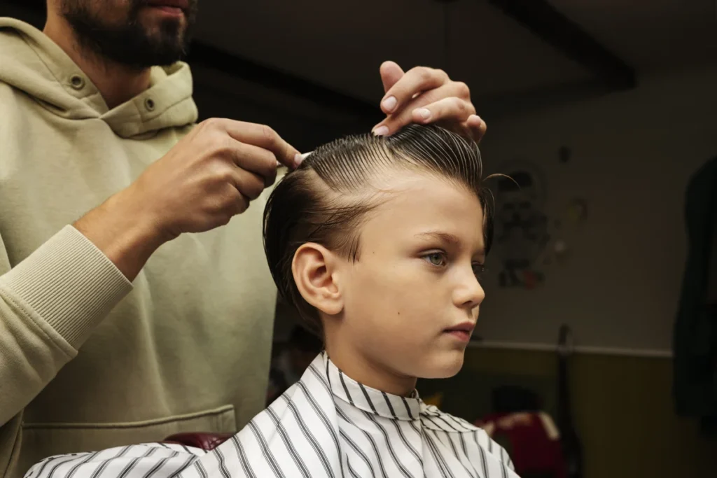 Faux hawk style featuring a bold center strip and clean fade for a balanced edge.