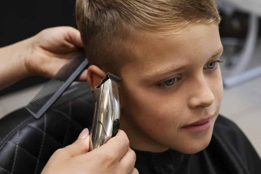 Short French crop haircut featuring a blunt fringe and tidy sides.