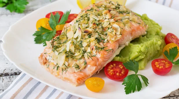 Baked salmon with cheese and almond crust and garnished-cheap and easy dinner recipes