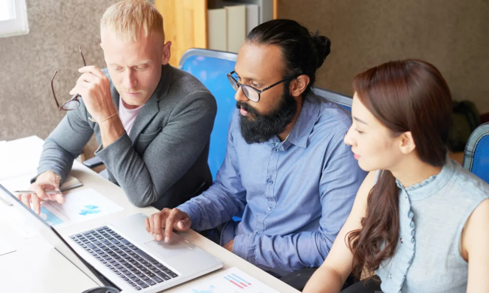 Business team collaborating on cybersecurity SEO strategies during meeting