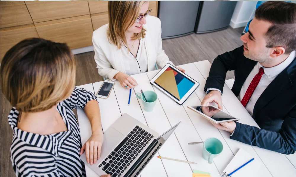 Business team implementing SEO tools together in office workspace