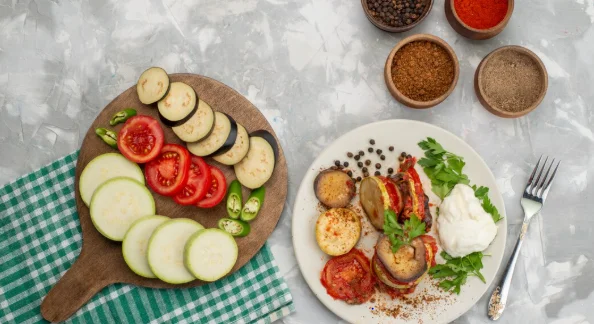 sliced vegetables such as eggplants and tomatoes with cooked vegetables-cheap meatless recipes