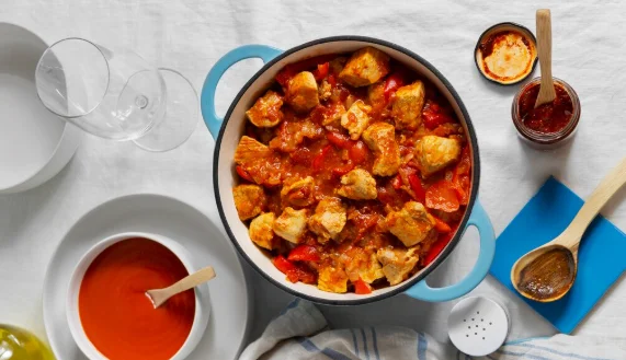 Flat lay delicious goulash on table still life