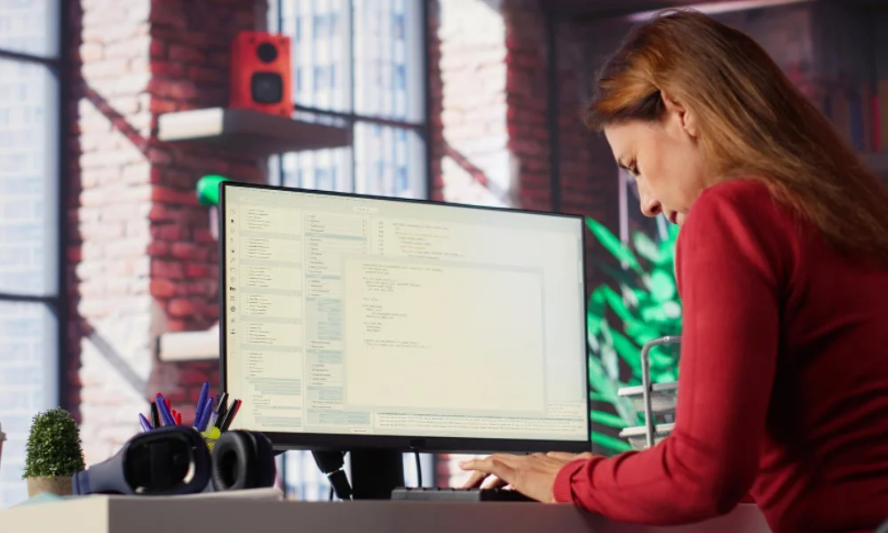 Developer coding schema markup on screen with structured data tags