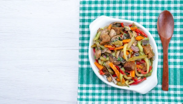 Top view sliced meat dish with cooked vegetables-cheap and easy dinner recipes