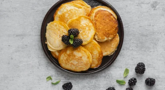 Top view pancakes with blackberries
