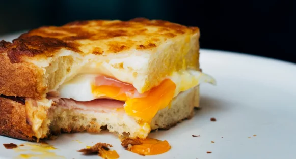 Bitten egg sandwich on a plate-simple brunch recipes
