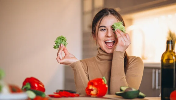 Woman cooking at kitchen-cheap vegetarian meal ideas