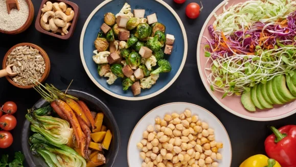 Buddha bowl dish with vegetables and legumes. top view.