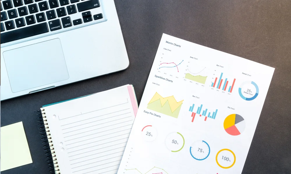 Laptop with marketing analytics charts and reports for SEO strategy planning.