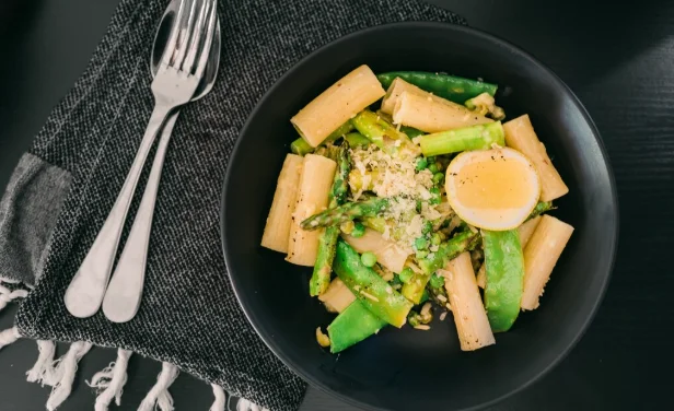 Plate with pasta asparagus and egg 