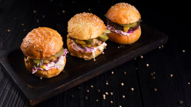 High angle set of burgers on a wooden board-simple brunch recipes