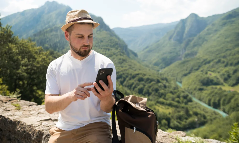 Modern traveler exploring digital tools to start a travel blog for future success