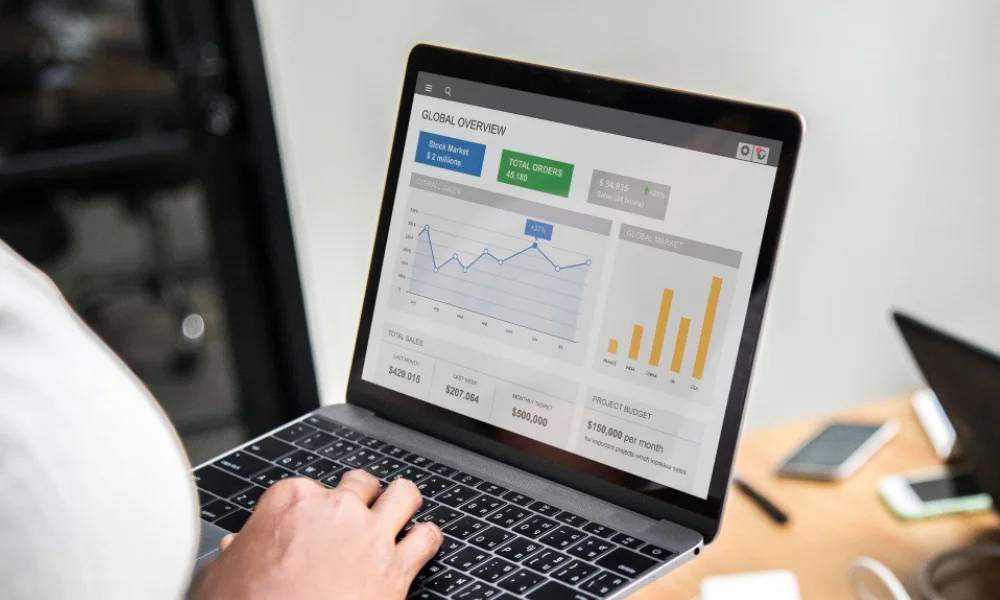 Open laptop with rising website traffic graph