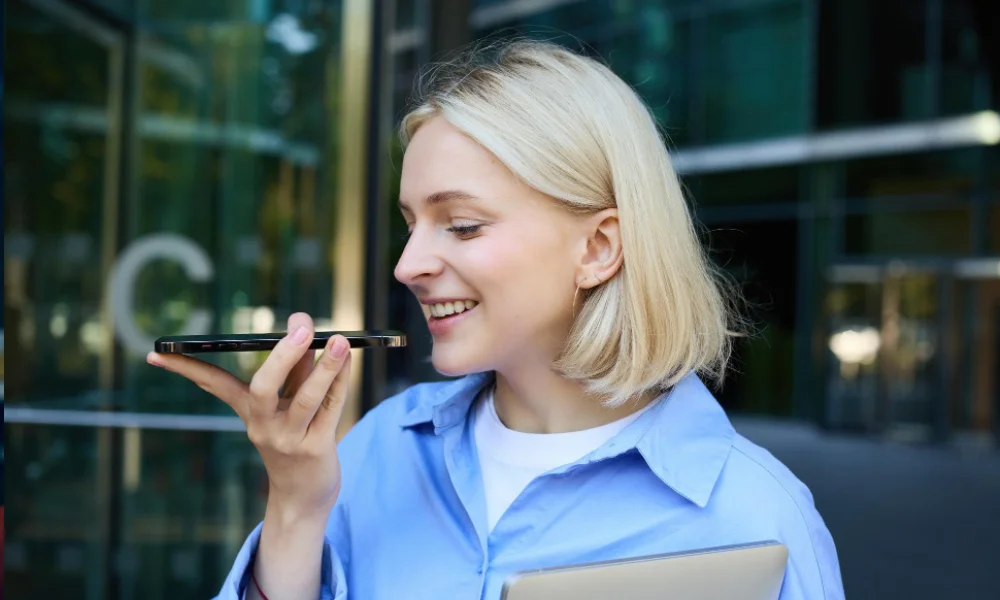 Person performing voice search on mobile device for local business results