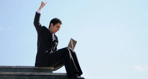 Businessman celebrating his success-how to improve yourself daily