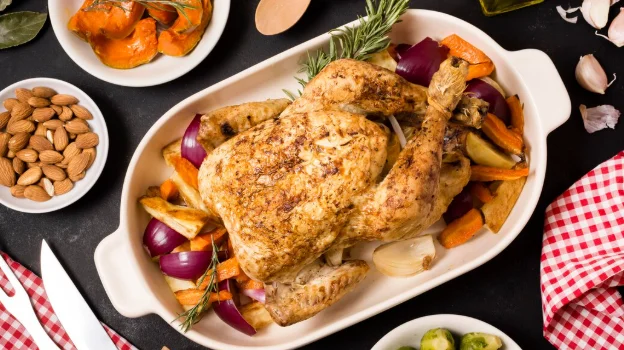 Flat lay of thanksgiving table with roasted chicken dish-cheap family meal