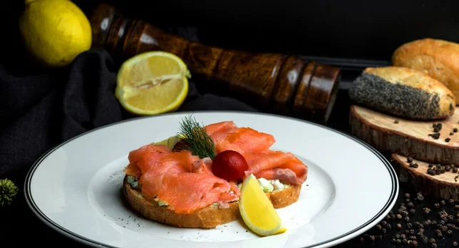 Smoked salmon bruschetta with avocado served with lemon-great brunch ideas