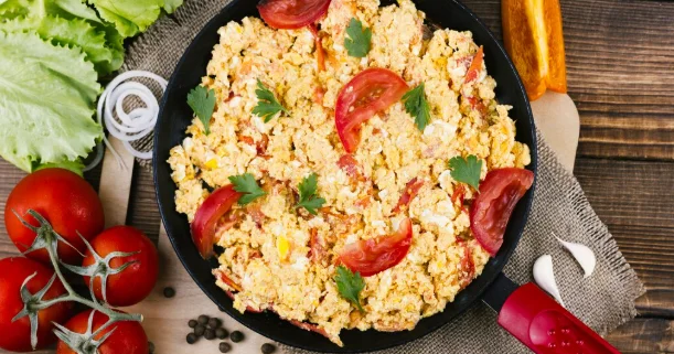 Flat lay scrambled eggs with tomatoes-easy brunch dishes