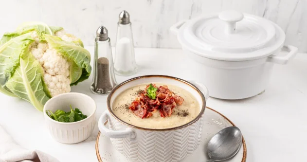 Cauliflower and white bean cream soup with fried bacon-potluck crockpot dishes