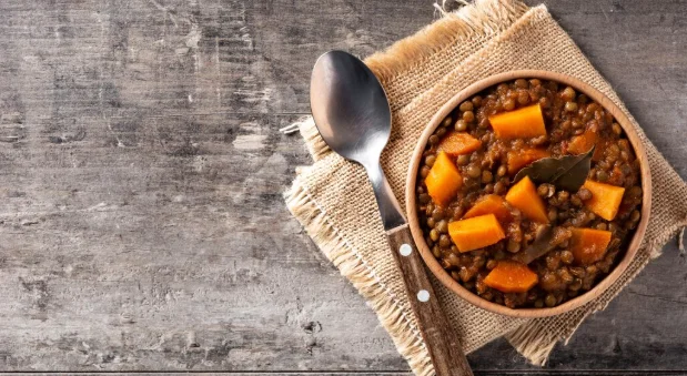 Lentil stew ragout with pumpkin and carrot in bowl-cheap slow cooker meals