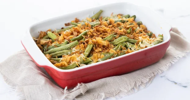 green bean casserole topped with french fried onions and cream of mushroom