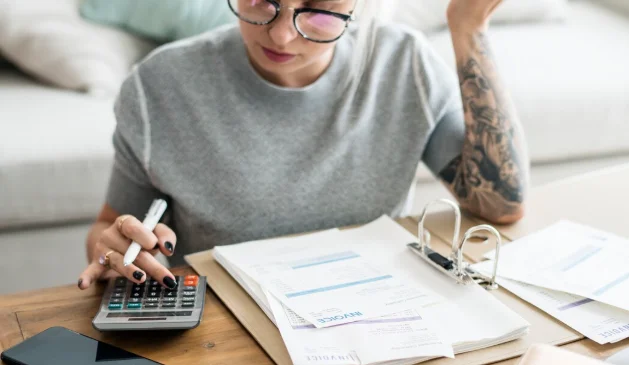 Caucasian woman with invoice bills