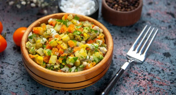 Front close view vegetable salad with seasonings