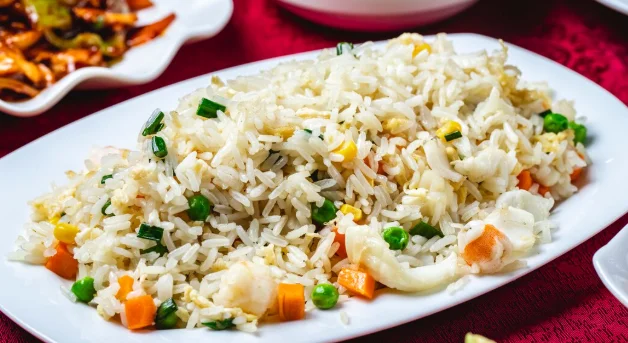 Steamed rice with seafood calamary corns carrot peas