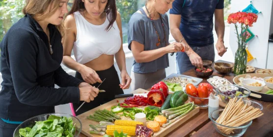 Serious people cooking in kitchen-crockpot potluck ideas
