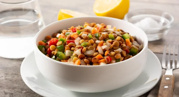 Lentil salad with peppersonion and carrot in bowl