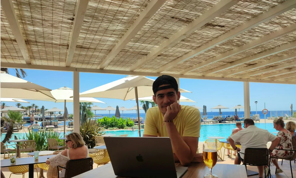 travel Blogger typing on a laptop