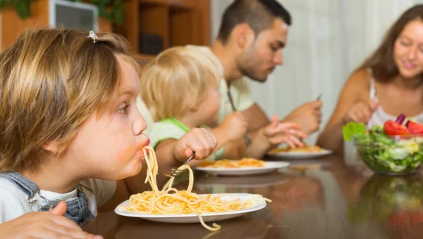 Family eating spaghetti