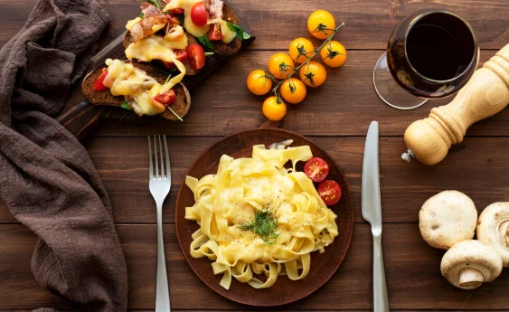 Top view of raclette dish with ingredients and delicious food-easy family dinners