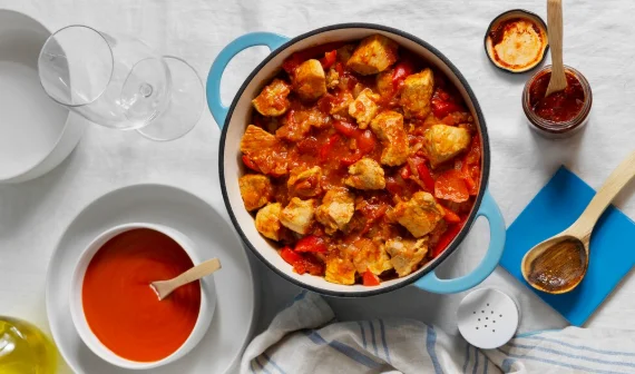 Flat lay delicious goulash on table still life