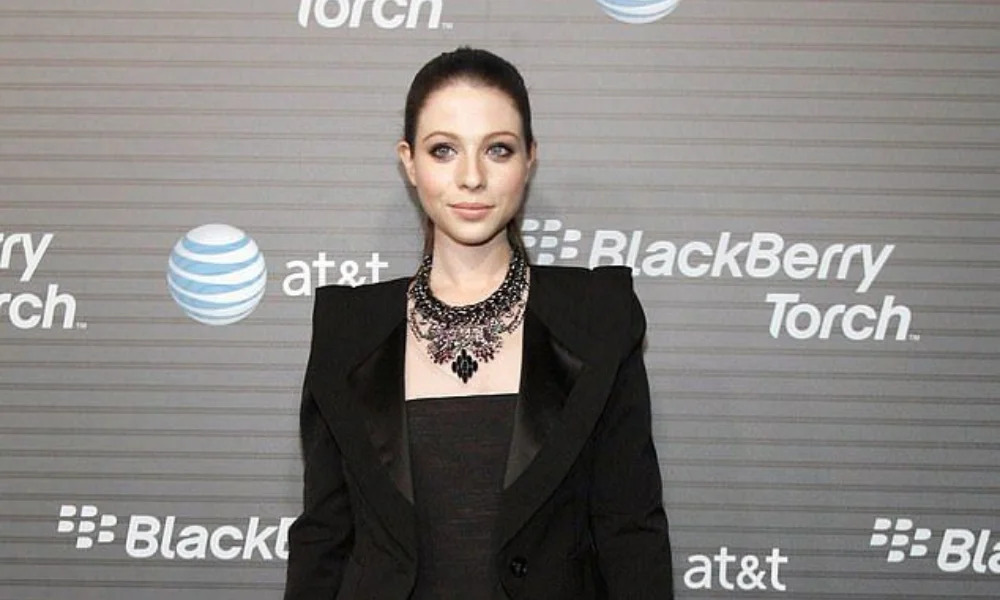 person with dark hair is wearing a black outfit