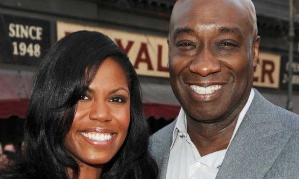 Smiling couple posing-michael clarke net worth