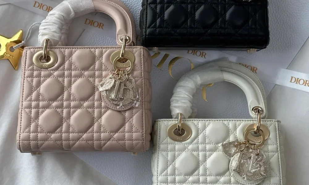 Quilted Lady Dior handbags in blush pink, white, and black displayed with signature charm hardware, highlighting iconic pieces when considering if luxury brands worth investing in