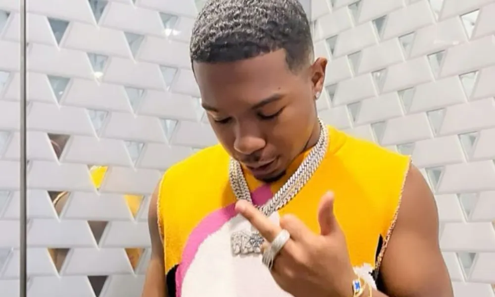 Deshae frost net worth 2026 is boosted by his career as an actor, comedian, and creator, pictured here wearing a vibrant graphic vest.