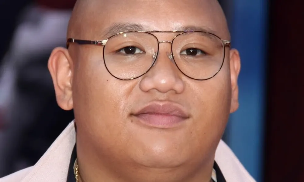 A portrait of Spider-Man star Jacob Batalon posing at a public event, illustrating his prominent acting career and expanding Jacob Batalon net worth.