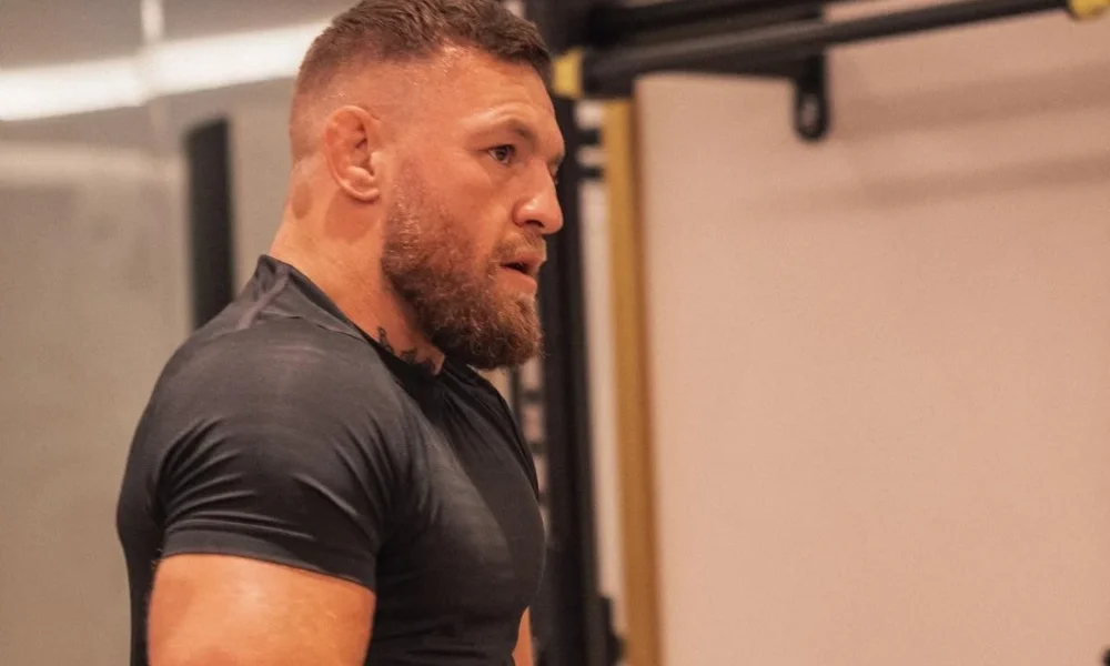 Conor McGregor focused during a gym workout session for articles on conormcgregor networth.