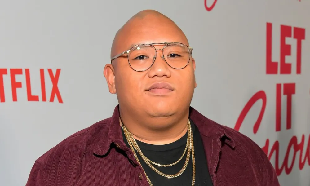 Jacob Batalon poses at a Netflix premiere event, illustrating his prominent acting career and expanding Jacob Batalon net worth.