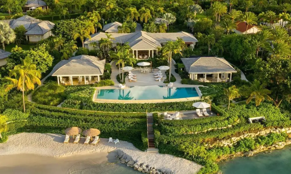 Exclusive beachfront villa estate surrounded by tropical palms for Most Exclusive Travel Destinations.