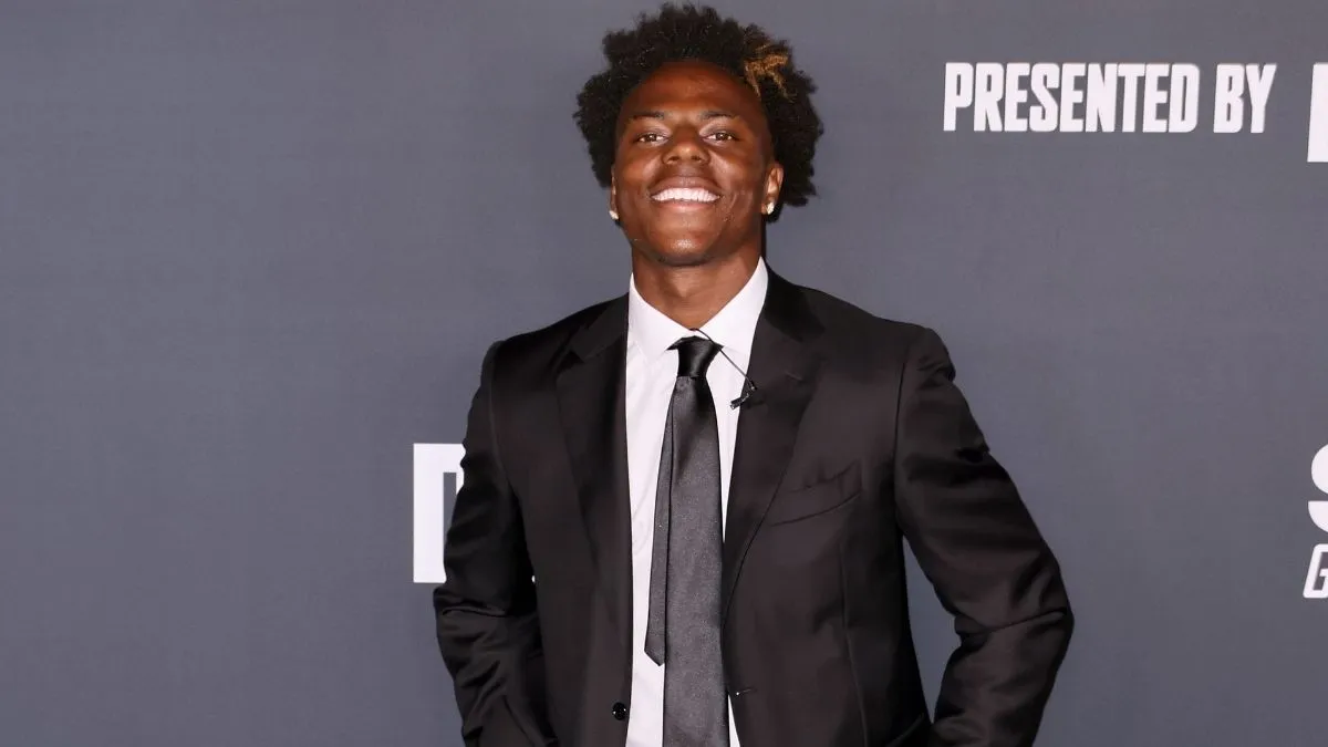 Streamer IShowSpeed smiling in a suit against a TIME event backdrop.
