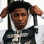 NBA YoungBoy poses thoughtfully in his first Instagram photo after being released from prison, signaling his return to music.