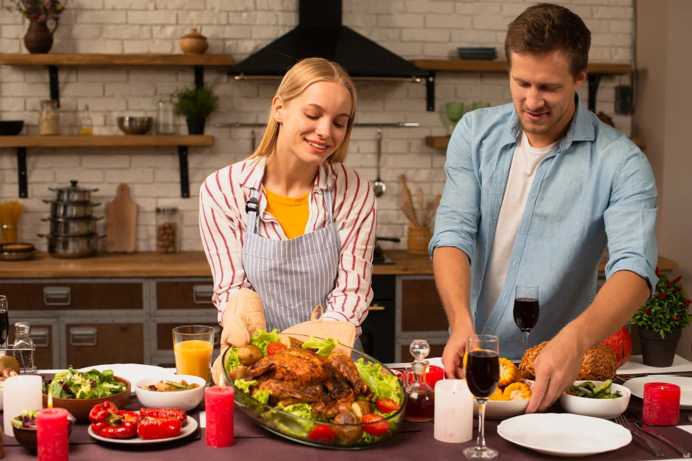 couple preparing the dinner food in the kitchen
